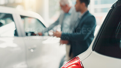 Buy stock photo Salesman, men and discussion by car at dealership with sale, negotiation and finance planning at shop. Client, people and agent for test drive, purchase and blur for deal with vehicle at showroom