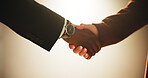 Handshake, partnership and welcome with business people in studio for agreement or b2b deal. Contract, meeting and thank you with corporate employee team shaking hands for greeting on wall background