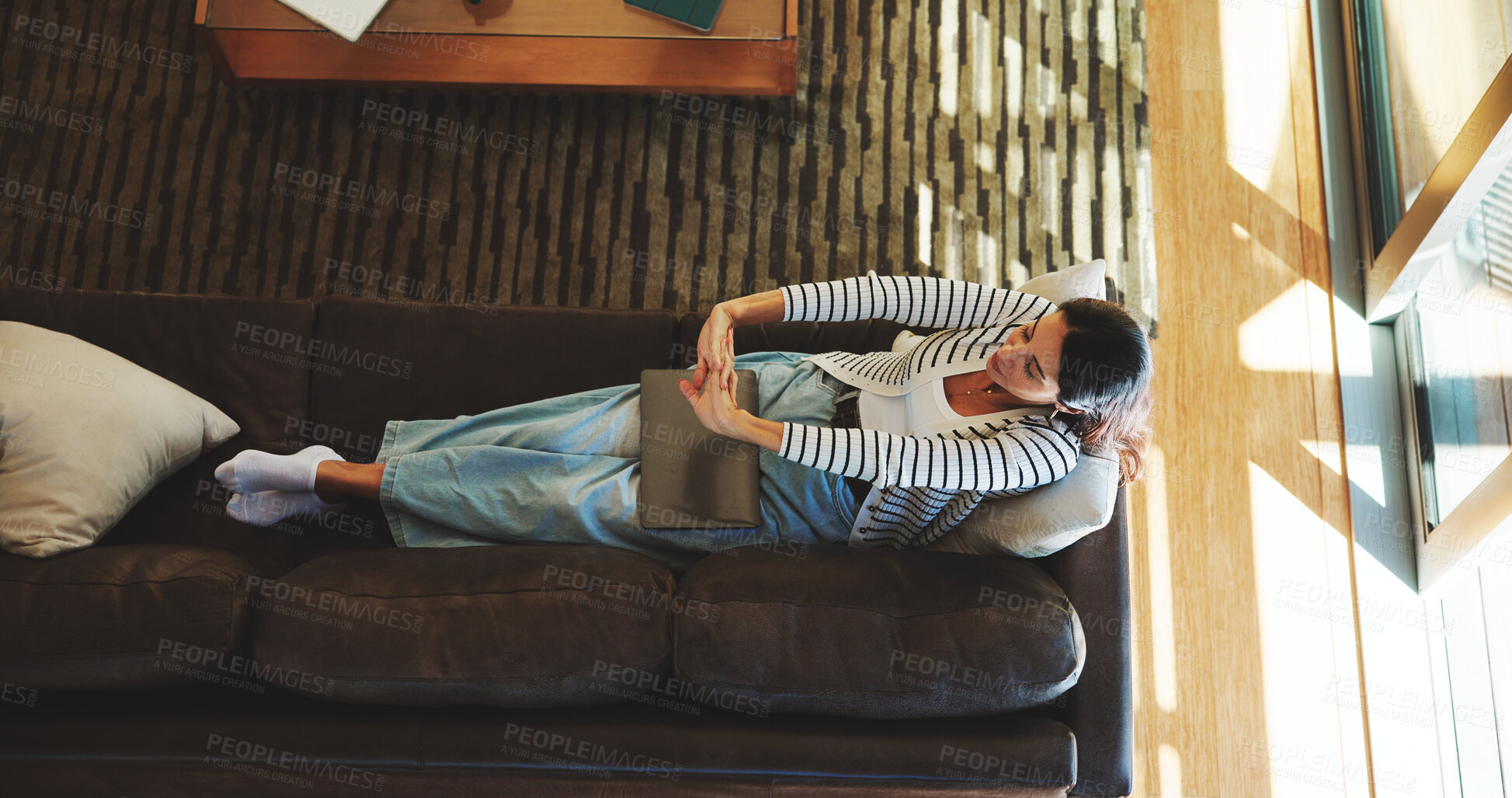 Buy stock photo Woman, done and stretching on sofa with laptop, relax and stress free for remote work. Above, entrepreneur or tech in home living room with time management, completed task and resting with comfort