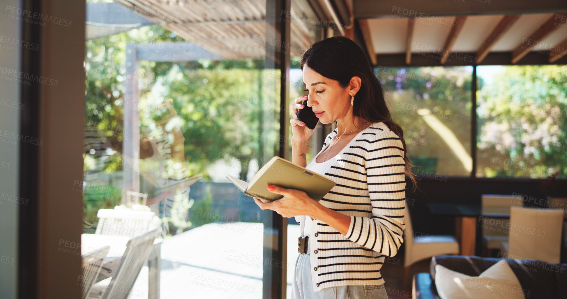 Buy stock photo Phone call, notebook and woman by window in home for remote work, virtual assistant and admin help. Communication, freelance and person on smartphone for contact, schedule and confirm appointment