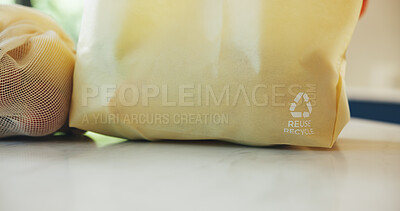 Buy stock photo Grocery bag, recycling symbol and shopping on kitchen counter for eco friendly conservation. Ecology, reusable and sustainability with groceries closeup in apartment for consumerism or zero waste