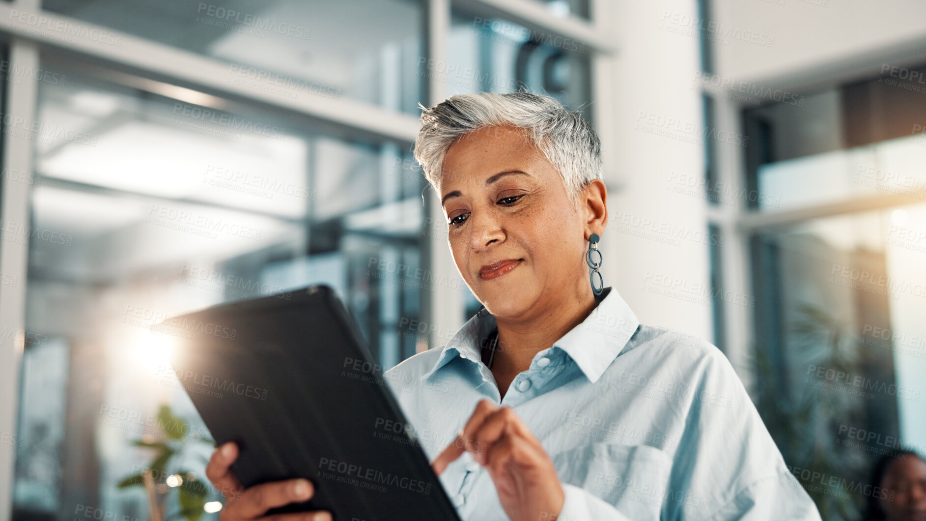 Buy stock photo Business, finance and tablet with mature woman in office for administration, planning or research. App, development and report with happy professional in corporate workplace for review of information