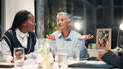 Buy stock photo Talking, office and business people in meeting for financial review, budget report and feedback at night. Working late, discussion and workers with paperwork for collaboration, strategy and planning