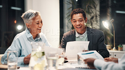 Buy stock photo Documents, manager and business people in meeting for financial review, budget report and feedback at night. Office, working late and workers with paperwork for collaboration, strategy and planning