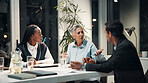 Discussion, night and business people in meeting for financial review, budget report and feedback. Corporate team, professional and workers with documents for collaboration, strategy and planning