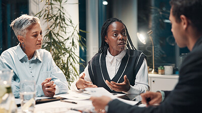 Buy stock photo Documents, night and business people in meeting in office for financial review, budget report and feedback. Corporate, overtime and workers with paperwork for collaboration, strategy and planning