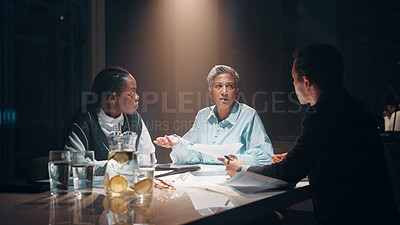 Buy stock photo Paperwork, teamwork and business people at night meeting for overtime, planning or research. Creative startup, collaboration and man and woman working on project, proposal and brainstorming in office