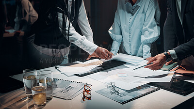 Buy stock photo Business, hands and teamwork with documents in office for tax preparation, financial analysis or overtime. Accountant, people and discussion at night for finance statement review or auditing deadline