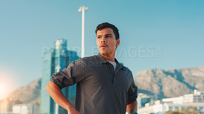Buy stock photo Breathing, fitness and thinking with man in city for break from cardio training or running. Exercise, fatigue and intense with athlete or runner outdoor in urban town for sports, vision or workout