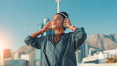 Buy stock photo City, fitness and music with woman outdoor for break from cardio or running routine. Exercise, headphones and streaming with athlete or runner in urban town for marathon, sports or workout challenge