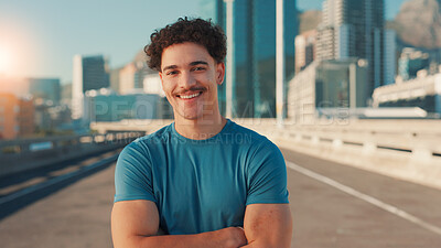 Buy stock photo Arms crossed, exercise and portrait of man on bridge in city for cardio workout or marathon training. Fitness, smile and sports with happy athlete or runner outdoor in urban town for challenge