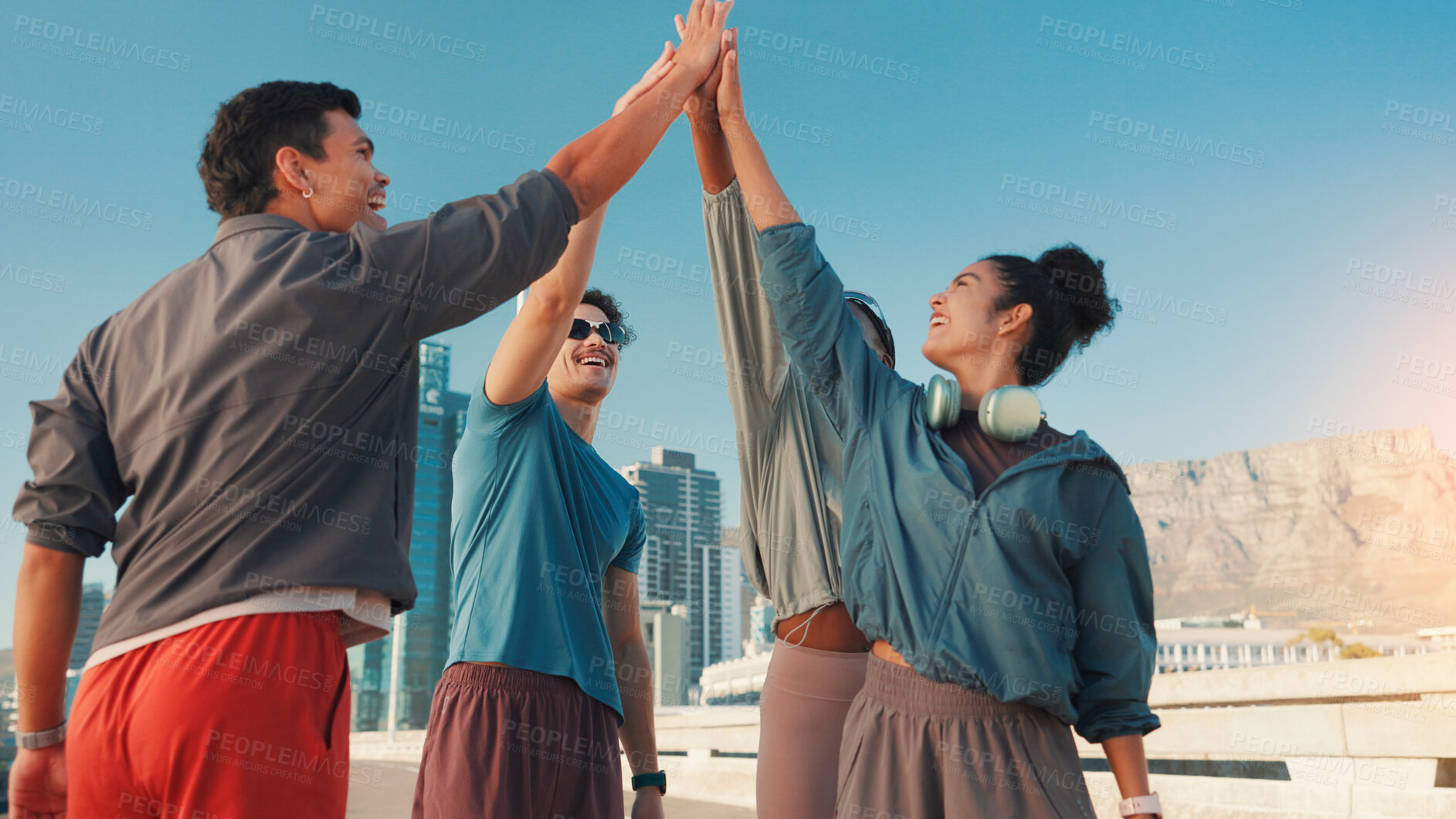 Buy stock photo Happy people, fitness and huddle with high five in city for workout goals, motivation or success. Active, group or friends with hands together for teamwork, exercise or achievement in an urban town