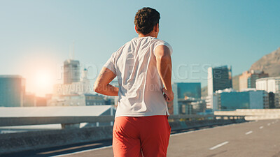Buy stock photo Back, man and running in city street for fitness workout, cardio exercise or outdoor training. Active, male person or runner with lens flare on road for physical activity, health or wellness in town