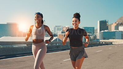 Buy stock photo Happy women, fitness and running in city street for workout, cardio exercise or outdoor training. Active, female people or runners with smile, race or sprint for marathon, health or wellness in town