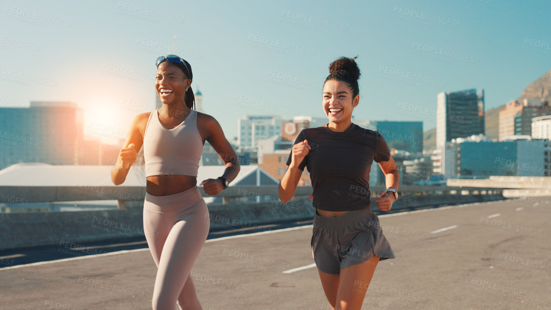 Buy stock photo Happy women, fitness and running in city street for workout, cardio exercise or outdoor training. Active, female people or runners with smile, race or sprint for marathon, health or wellness in town