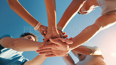 Buy stock photo People, team and hands together in fitness with blue sky below for motivation, unity or mission. Low angle, group or friends piling with stack in huddle, circle or solidarity for health and wellness