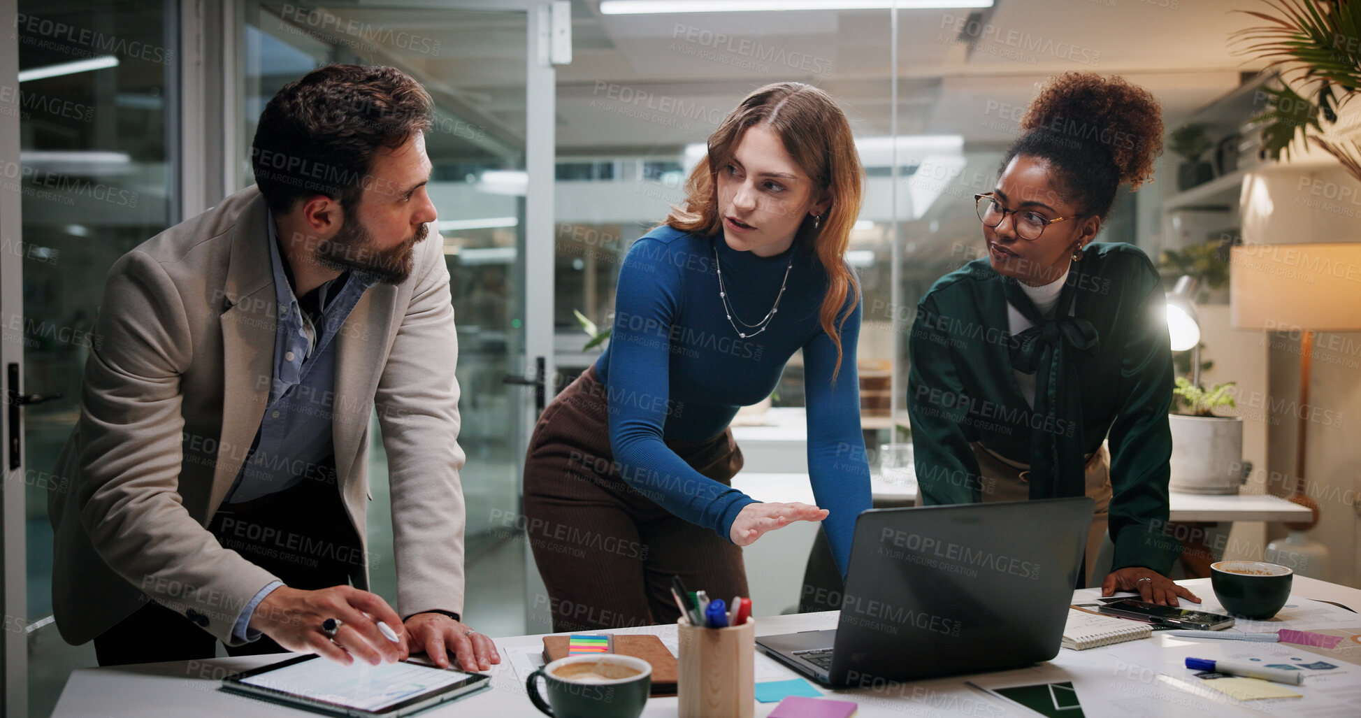 Buy stock photo Creative, teamwork or planning with laptop in office at night for marketing campaign, design feedback or brainstorming. Graphic designer, people or discussion for brand development, ideas or overtime
