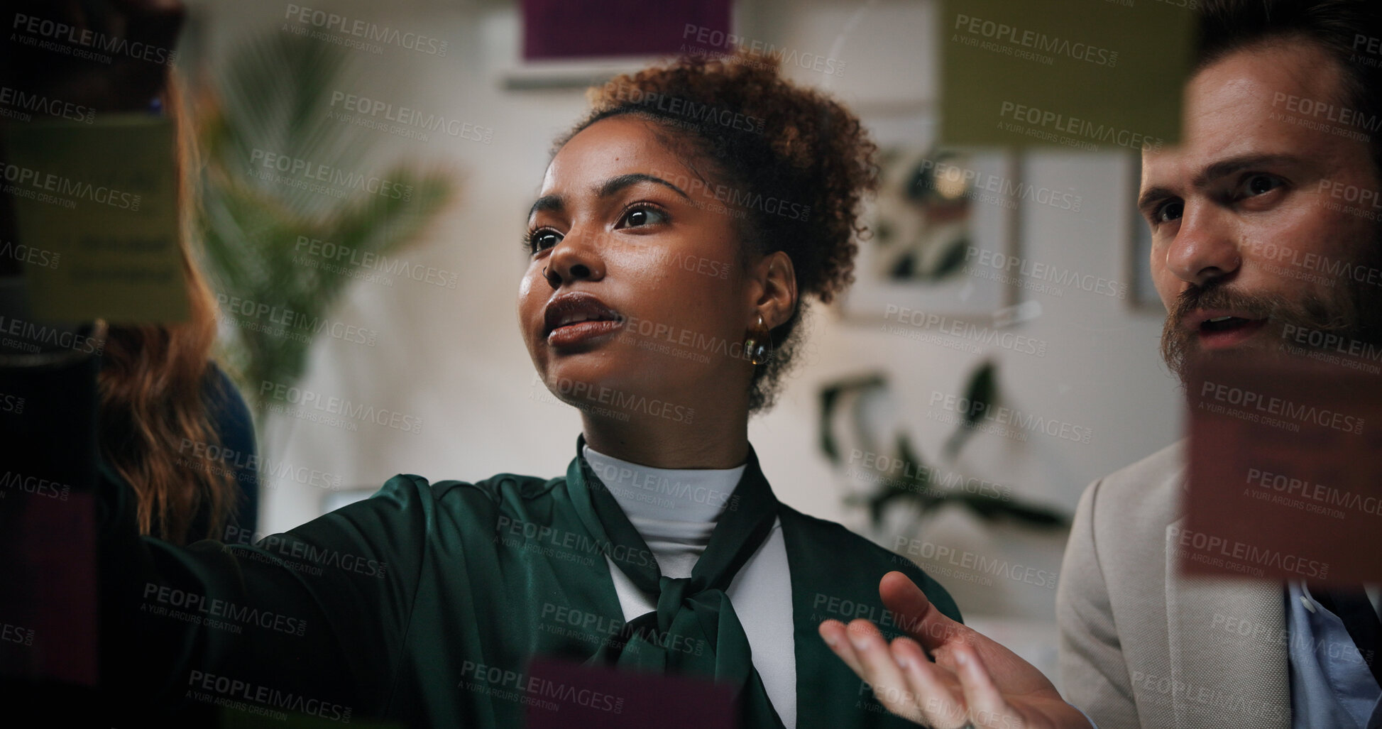 Buy stock photo Brainstorming, team and discussion for ideas, glass and man with advice for marketing strategy and night. Meeting, overtime and people with sticky notes for problem solving, explaining and planning