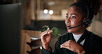 Black woman, explain and computer in call centre at night for contact us, online assistance and advice. Agent, headset and pc with instructions for solution, customer service and feedback of overtime