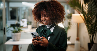 Buy stock photo Business woman, cellphone and designer typing in office for communication, overtime or fashion inspiration. Female person, tech and scroll for design feedback, social media and search at night