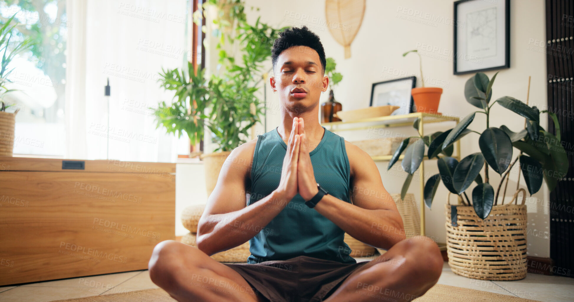 Buy stock photo Man, namaste and meditation for yoga at house for fitness, zen balance and mindfulness in lounge. Male person, eyes closed and chakra routine of morning peace, spiritual healing and holistic wellness