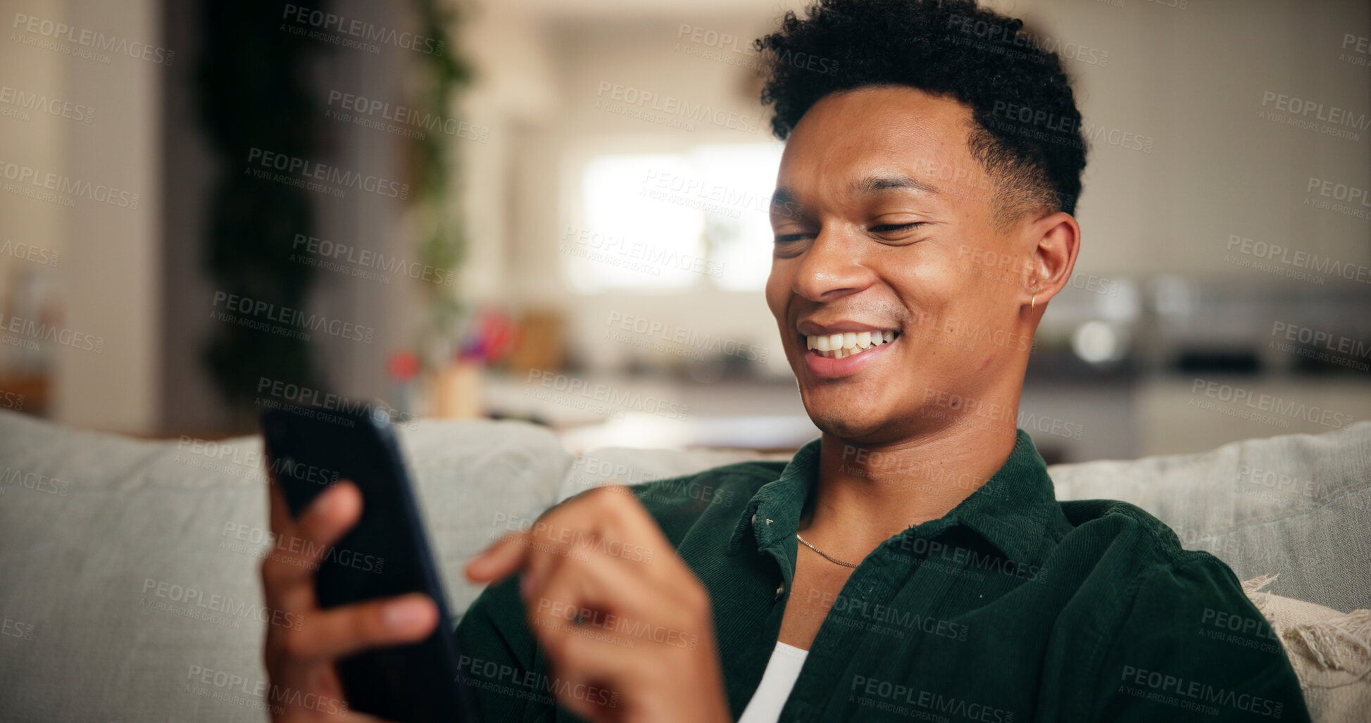 Buy stock photo Relax, smile and phone with man on sofa for social media, movie platform and streaming service. Happiness, entertainment app and subscription with person in living room at home for multimedia search