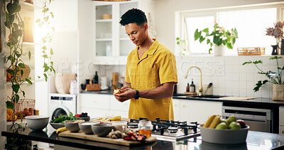 Buy stock photo Banana, cooking and concentration with man in kitchen of home for hobby, meal prep or nutrition. Ingredients, peeling and recipe with person in apartment for diet, health or supper as culinary chef