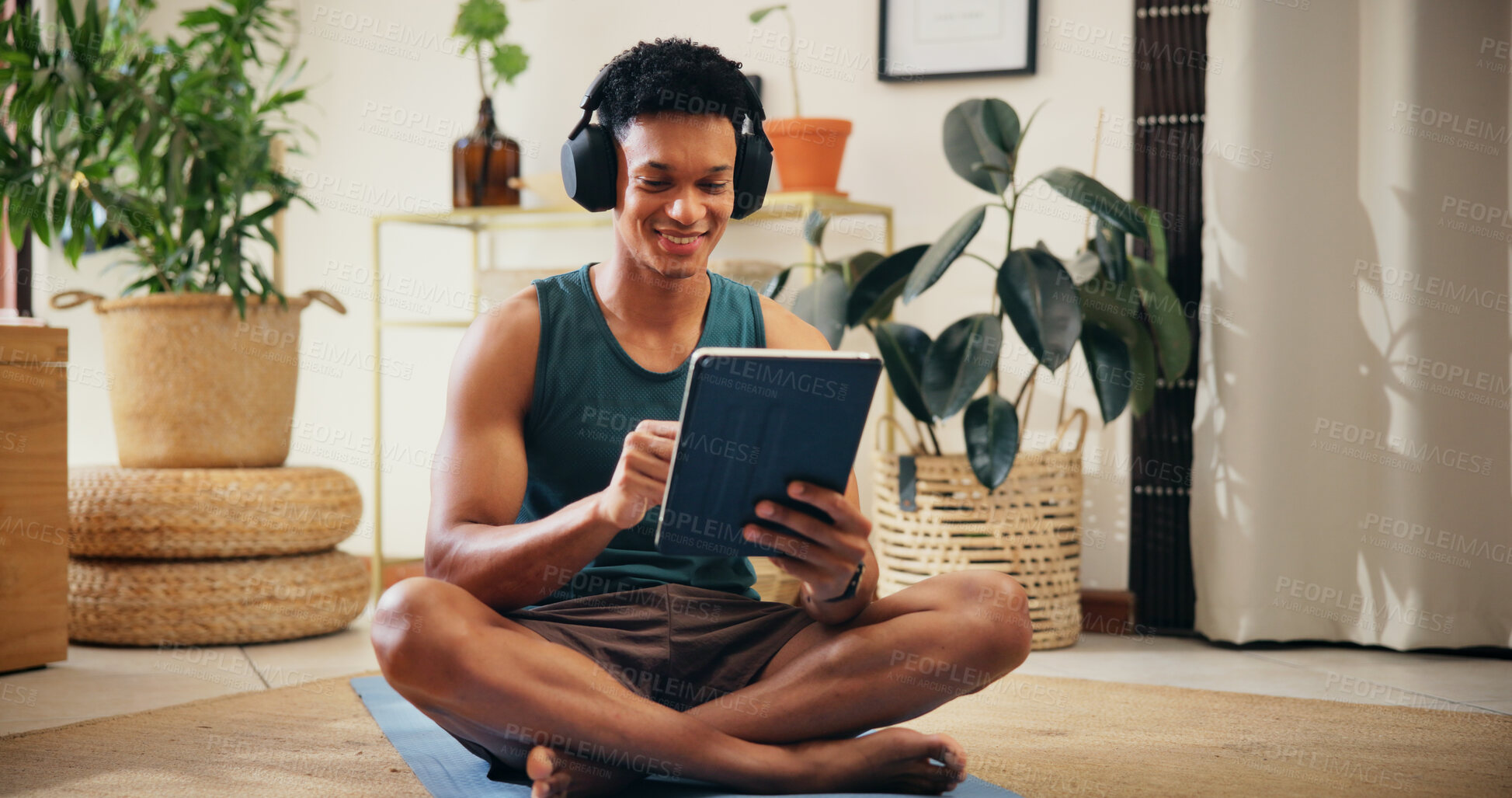 Buy stock photo Home, man and tablet with music for exercise, virtual fitness and application for audio track. House, male person and break with technology for social media, workout tips and headphones with smile