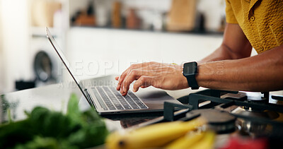 Buy stock photo Cooking, hands and laptop with person in kitchen of home to search for instructions or recipe. Computer, meal prep and typing with man closeup in apartment for diet, health or nutrition as chef