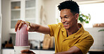 Blender, health and man in kitchen in home for liquid diet with breakfast, nutrition or wellness. Beverage, detox and male person with fruit smoothie for vitamins, snack or protein shake in apartment
