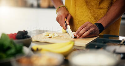 Buy stock photo Cooking, hands and cut banana in kitchen for meal preparation, healthy salad and lunch recipe. Nutrition, closeup and person with fresh fruit ingredients in home for vegetarian snack and organic diet