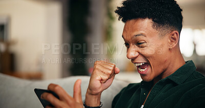 Buy stock photo Gaming, phone and winner with man on sofa for esports streaming, cyber sport league and fist pump. Celebration, gamer success and app platform with excited person in home for online tournament