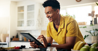 Buy stock photo Tablet, kitchen and man with recipe online for cooking healthy, wellness or diet dinner. Digital technology, research and person on app for supper preparation tutorial or instructions in home.