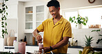 Man, smile and smoothie in kitchen for mixing, detox diet or meal replacement recipe for wellness. Nutritionist, happy or drink in home for gut health, vitamin boost or fresh fruit in protein shake