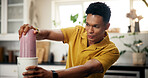Blender, wellness and man in kitchen in home for liquid diet with breakfast, nutrition or health. Beverage, detox and male person with fruit smoothie for vitamins, snack or protein shake in apartment