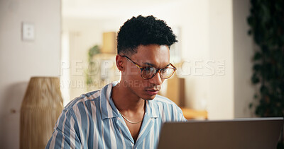 Buy stock photo Man, glasses and reading on laptop at house for research, proofreading article and report information. Journalist, online and review news for story update, editing draft and schedule  for publication