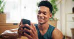 Home, man and happy with smartphone for fitness, virtual exercise and scroll on website application. House, male person and break with mobile for social media, workout tips and smile with technology
