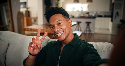 Buy stock photo Man, peace sign and selfie in home for social media, influencer or content creation with smile in picture. Live streaming, hand gesture and person with memory, update or post for photography portrait