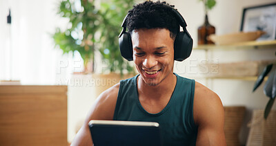 Buy stock photo Home, man and tablet with music for fitness, virtual exercise and application for audio track. House, male person and break with technology for social media, workout tips and headphones with smile
