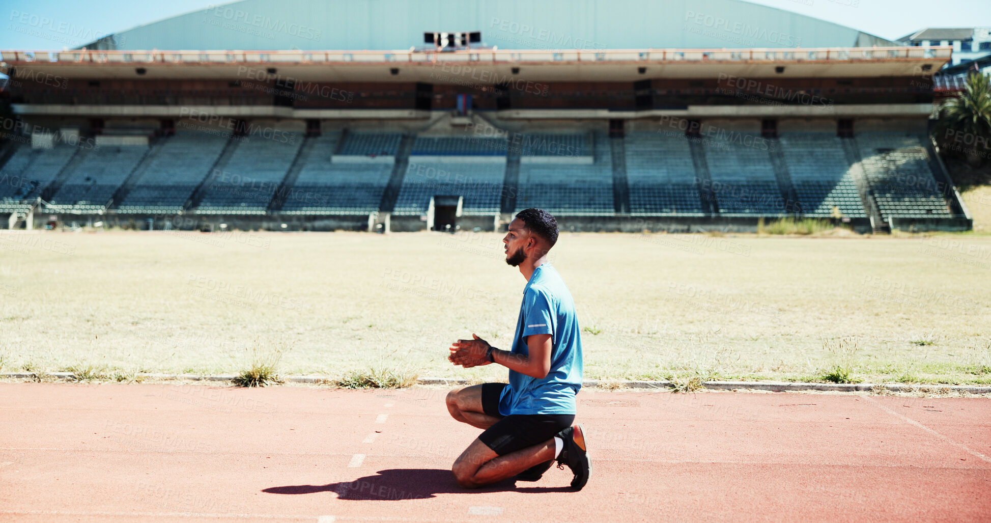 Buy stock photo Start, competition and athlete or man on race track for fitness, training and cardio performance. Health, marathon and sports runner with person and outdoor stadium for running, ready and workout