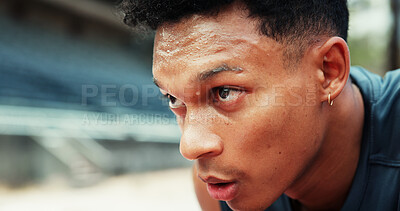 Buy stock photo Athlete, man and tired with sweating at stadium for running performance, endurance challenge and race fatigue. Fitness, runner and exhausted with breathing for exercise recovery, marathon and resting