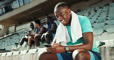 Buy stock photo Stadium, man and laughing with smartphone for fitness, online communication and meme on application. Outdoor, male person and typing with mobile for funny chat, social media and break for exercise