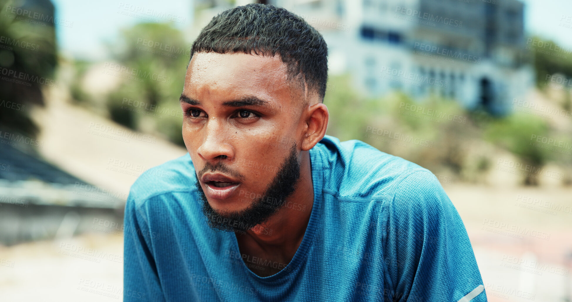 Buy stock photo Fitness, man and tired with breathing at stadium for race competition, running burnout and endurance challenge. Runner, athlete and sweating with fatigue for marathon recovery, exercise and exhausted