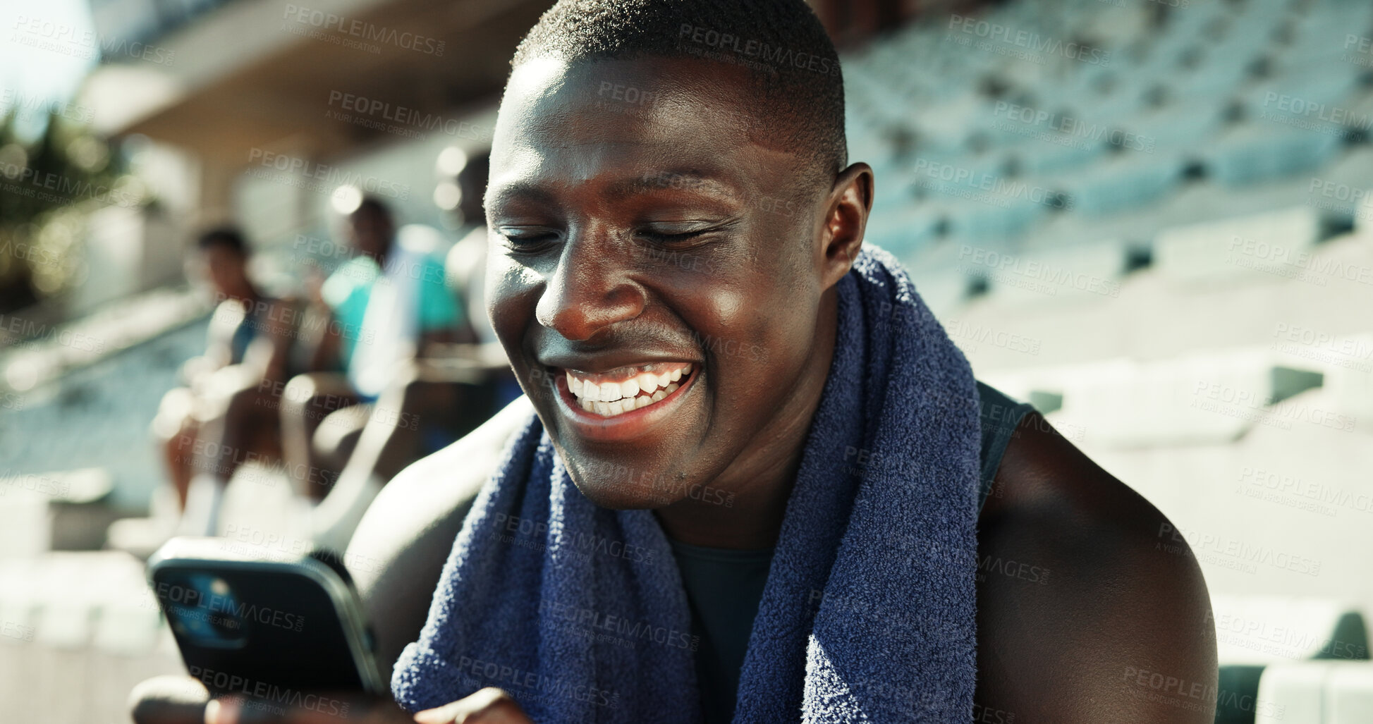 Buy stock photo Athlete, man and happy with phone on stadium for workout post, streaming service or social media scroll. Fitness, runner and smartphone at sports arena for practice break, text message or mobile chat