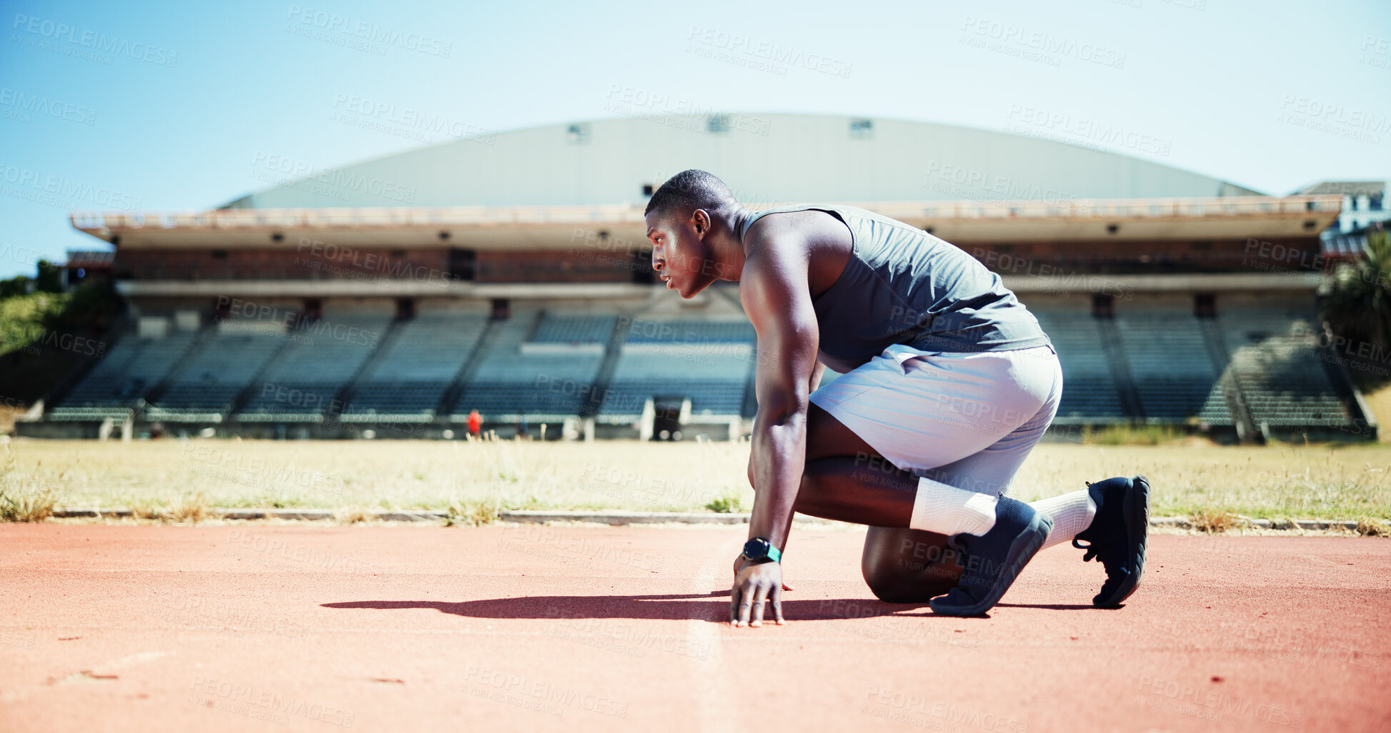 Buy stock photo Ready, fitness and athlete or black man on running track for sports, training and cardio performance. Health, marathon and runner with person and outdoor stadium for competition, start and workout