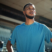 Fitness, runner and man with thinking at stadium for competition ...