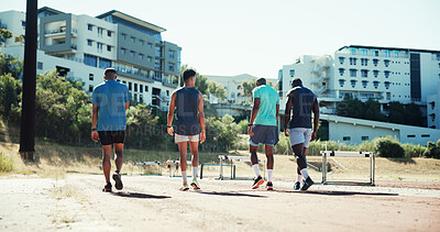 Buy stock photo Men, track and group with hurdles, training and back with equipment, runner and exercise in summer. Team, people and athlete with workout, fitness and outdoor with support for sports competition