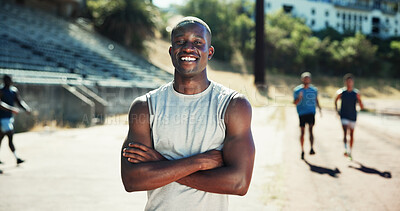 Buy stock photo Portrait, active and black man with pride at stadium for exercise, sports training and practice on track field. Male runner, arms crossed and fitness for workout, endurance and challenge for marathon