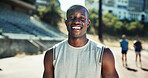 Portrait, athlete black man with smile at stadium for exercise, sports training and practice on track field. Male runner, happy and confidence for fitness, workout and endurance of marathon challenge