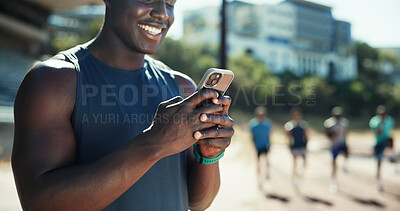 Buy stock photo Outdoor, man and hands with smartphone for fitness, online communication and chat on application. Stadium, male person and athlete with mobile for typing message, social media and break for exercise